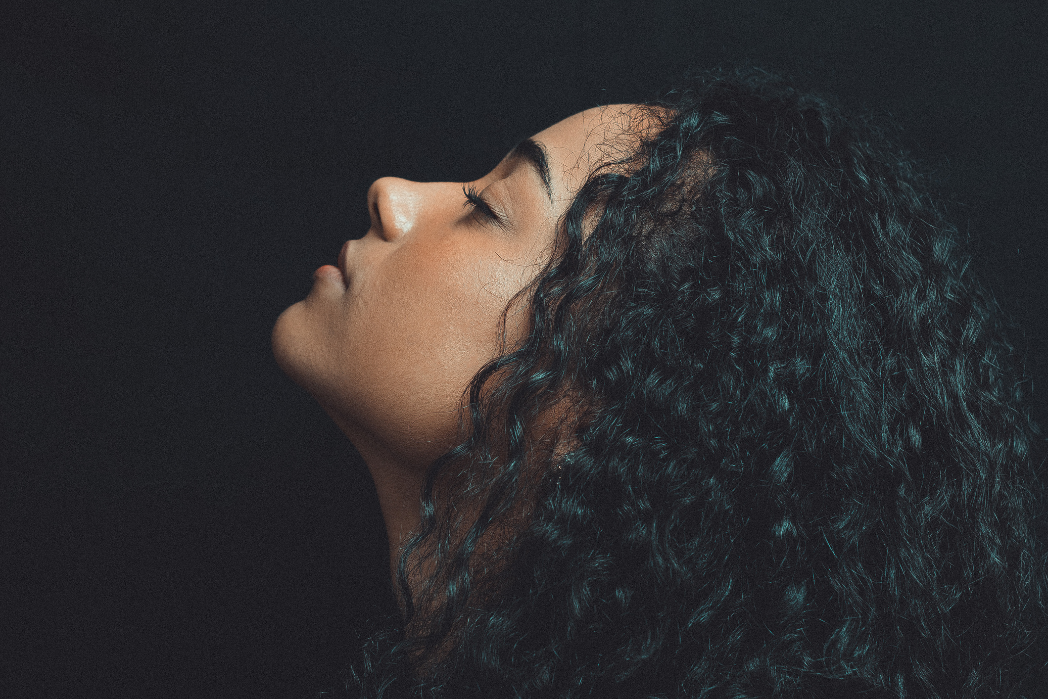 Close-Up Photo of Woman With Curly Hair